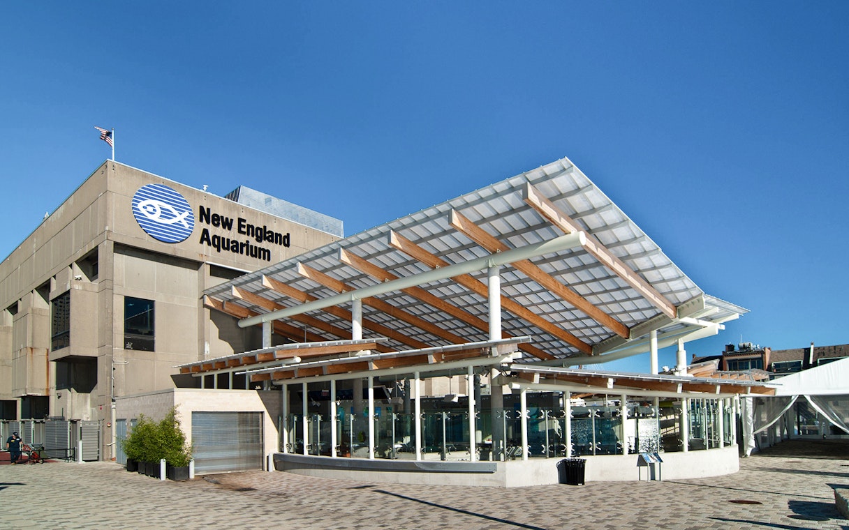 New England Aquarium exterior with modern glass and wood design.