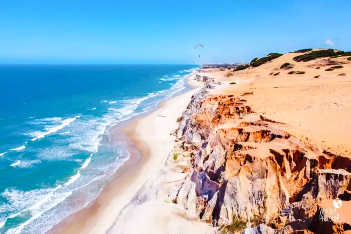 Colorful cliffs and beach at Canoa Quebrada, East Coast tour from Sao Paulo.