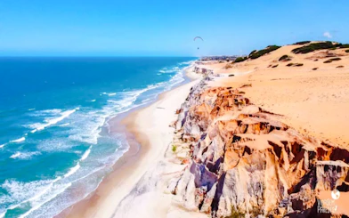 Colorful cliffs and beach at Canoa Quebrada, East Coast tour from Sao Paulo.