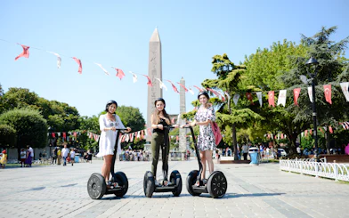 Tourists on Segways in Istanbul's Old Town near the Obelisk of Theodosius.