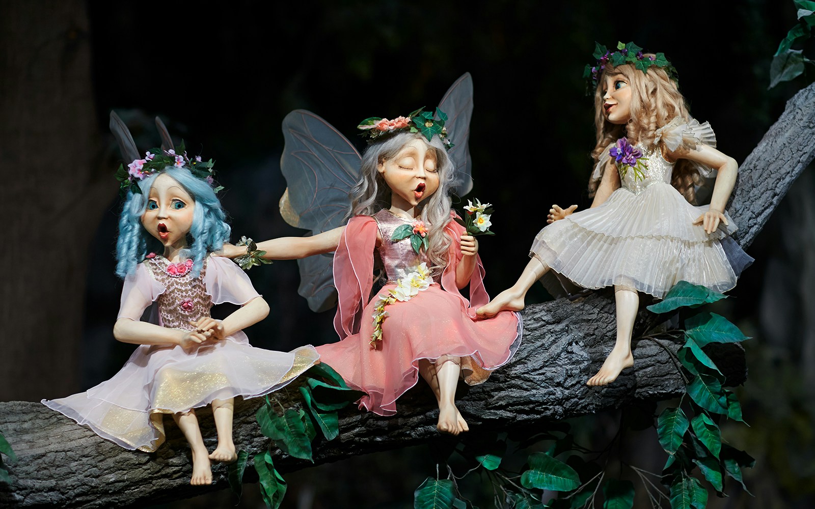 Fairy tale characters on a tree branch at Efteling theme park, Netherlands.