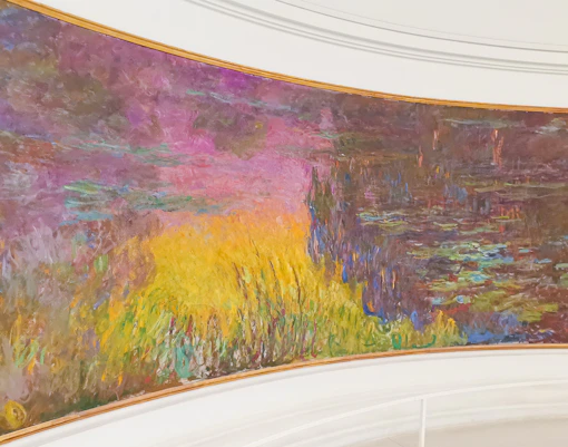 Visitors viewing Monet's Water Lilies at Orangerie Museum, Paris.
