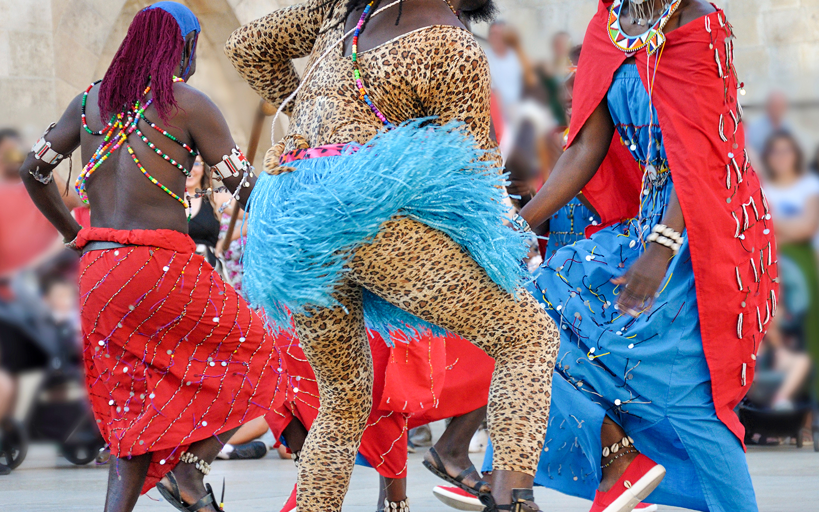 Kenyan dancers in traditional folk costumes performing at Mombasa Carnival, Kenya.