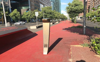 Berlin Tiergarten street view with modern buildings and red pathway.