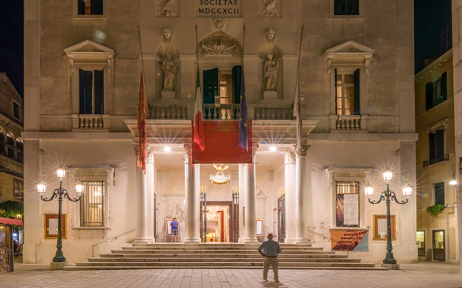 Night view of the facade of the famous Gran Teatro La Fenice theater, San Marco district, Venice, Italy