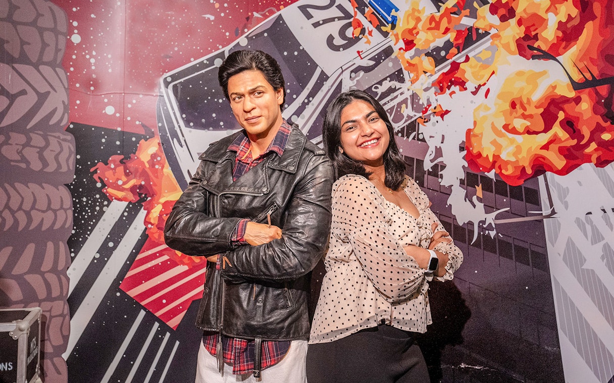 Shah Rukh Khan wax figure at Madame Tussauds Sydney with visitor.