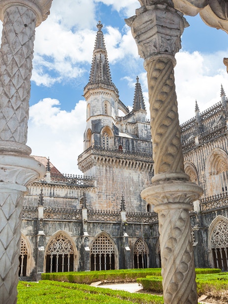 Batalha Monastery's ornate Gothic architecture with detailed arches and spires in Portugal.