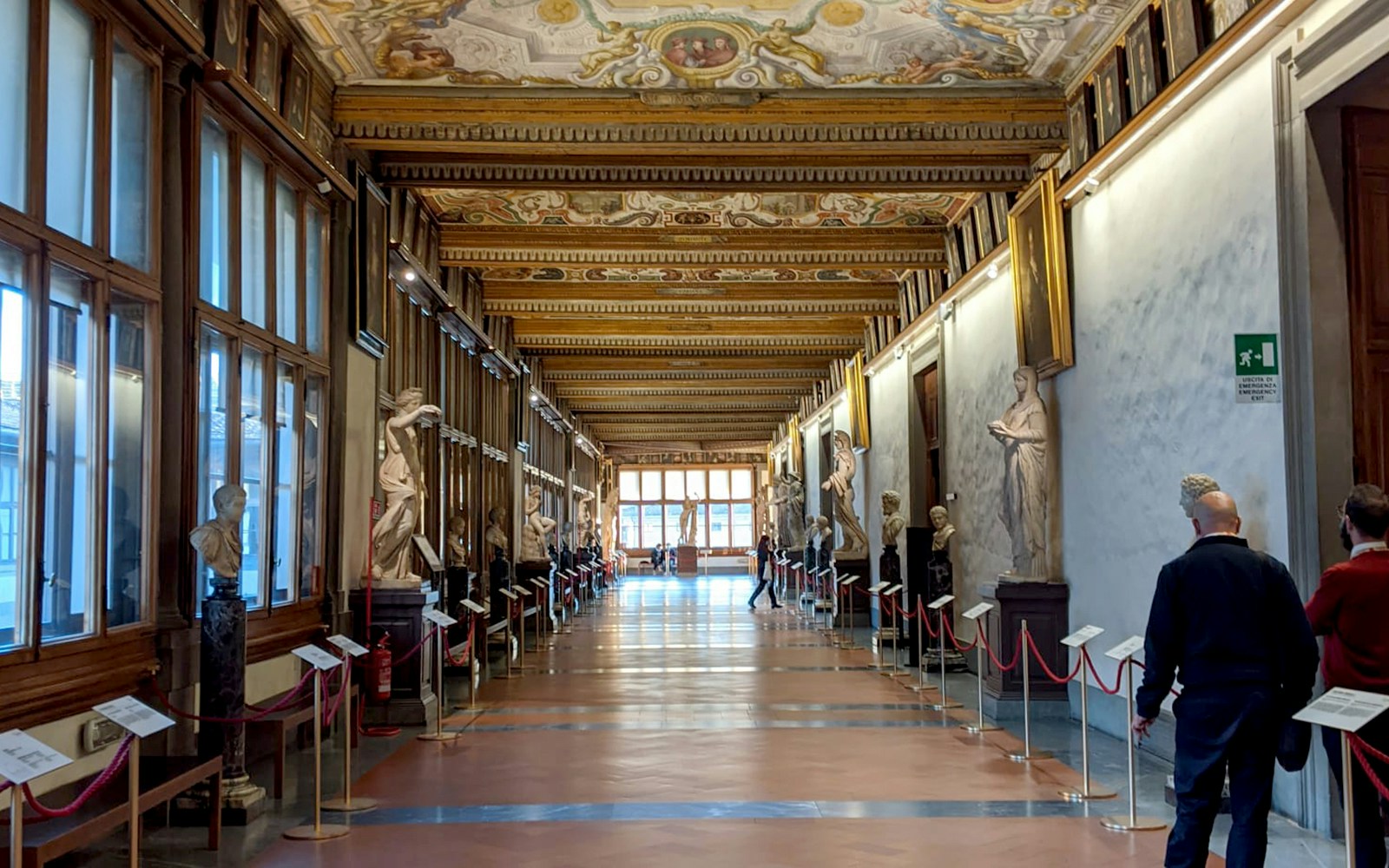 Accademia Gallery entrance with visitors, Florence Wonders Tour, Renaissance art focus.