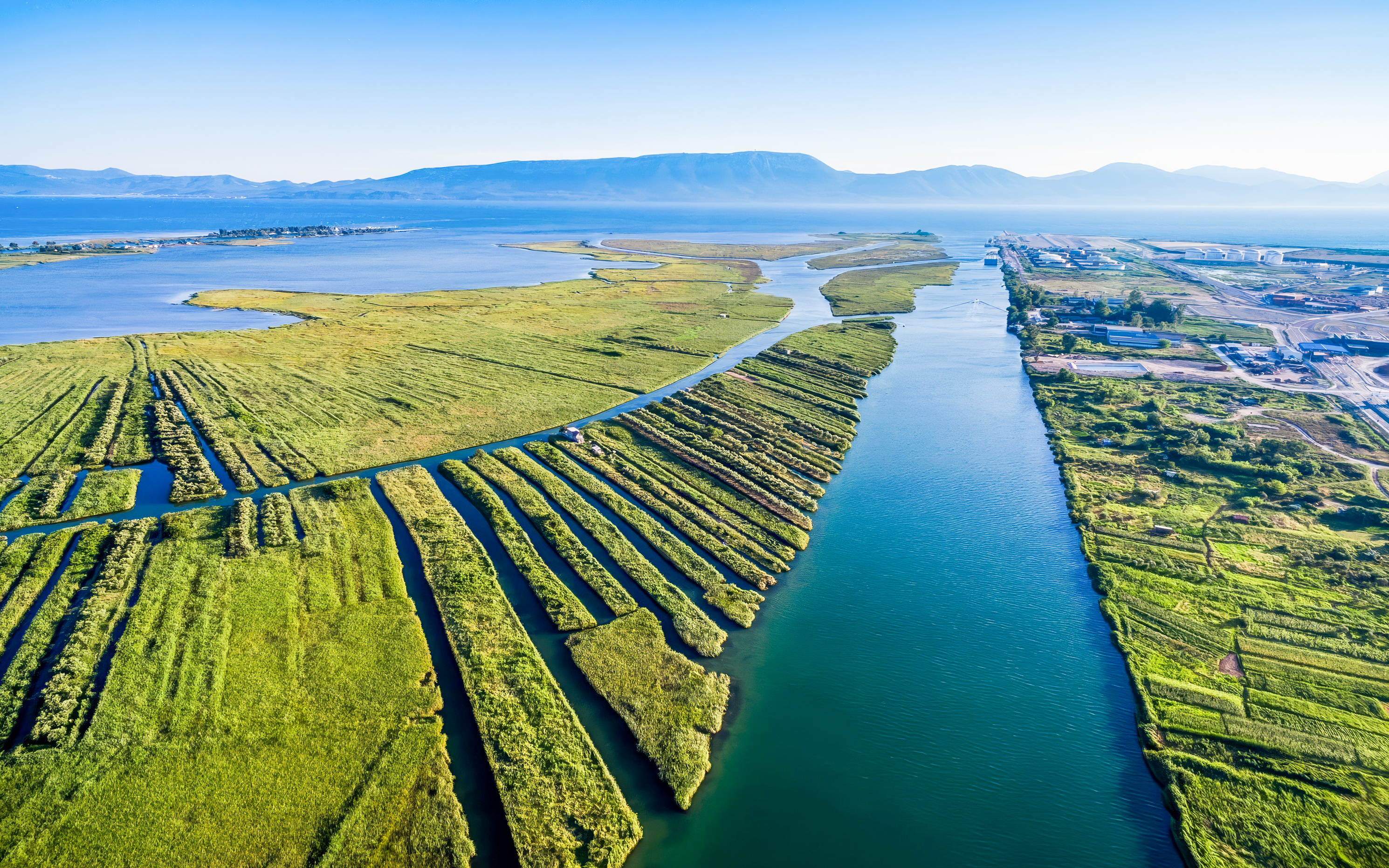 Aerial view of the Neretva River Delta's lush green wetlands in Croatia.
