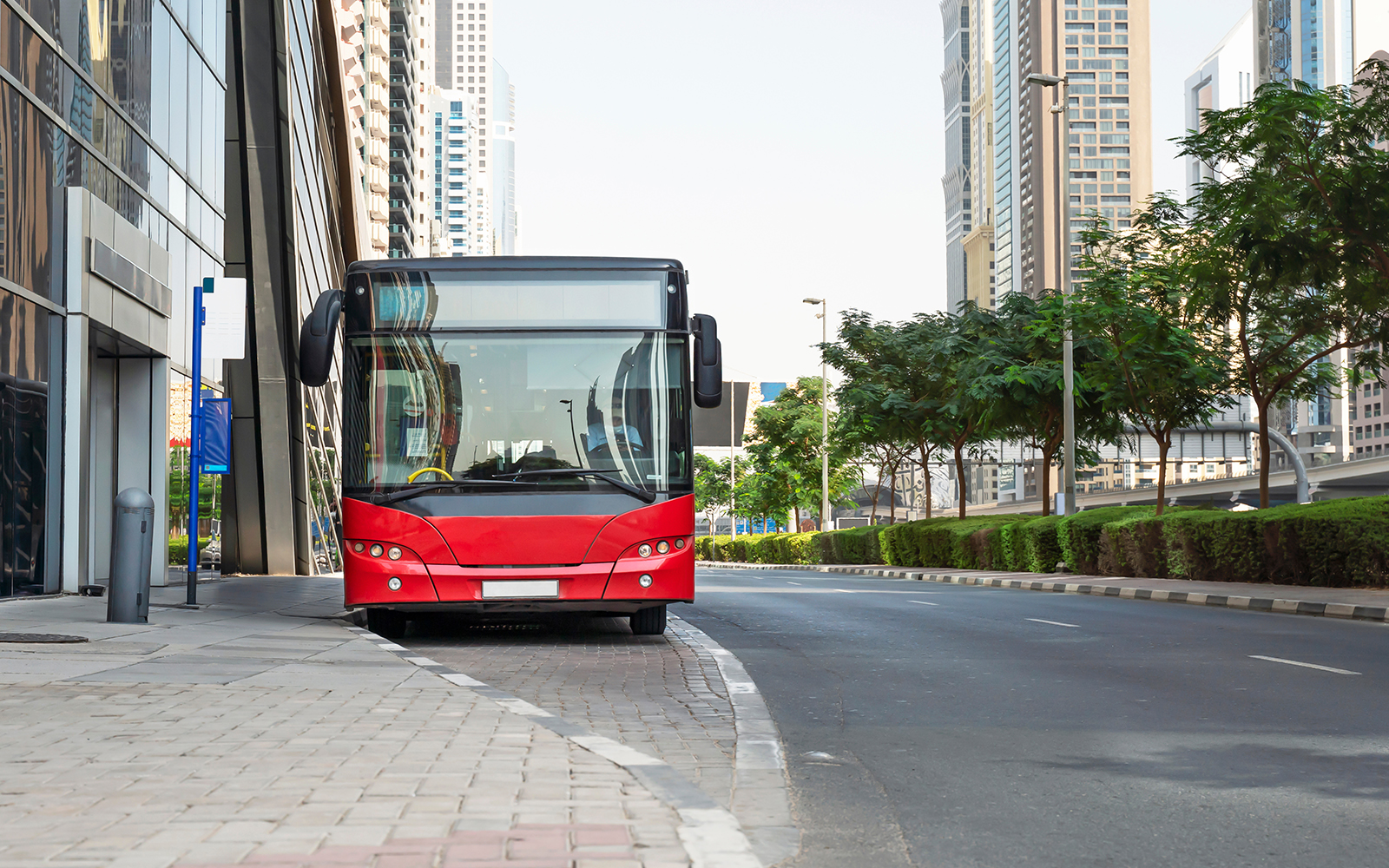 Tourist bus on the street of Dubai, United Arab Emirates.