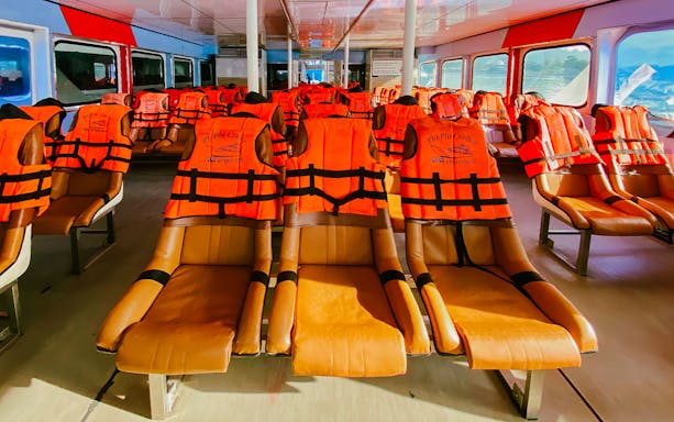 Ferry interior with life jackets on seats for transfers from Phuket to Phi Phi, Krabi, and Lanta.