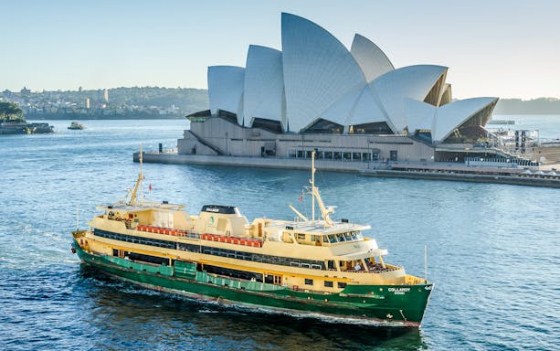Ferry crossing Sydney Harbour with the Opera House in the background.
