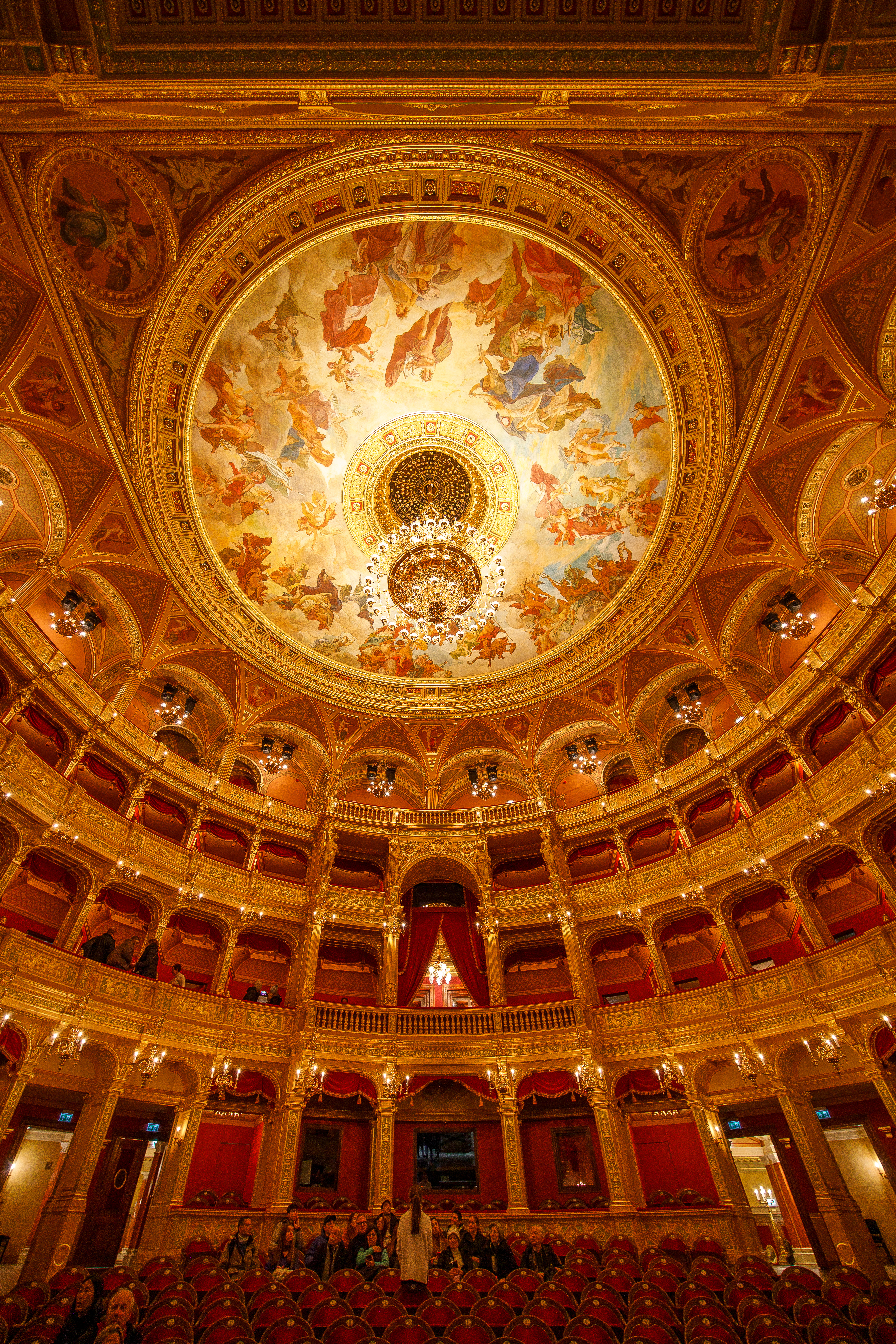 Guests and tour guide inside the ornate Hungarian State Opera House.