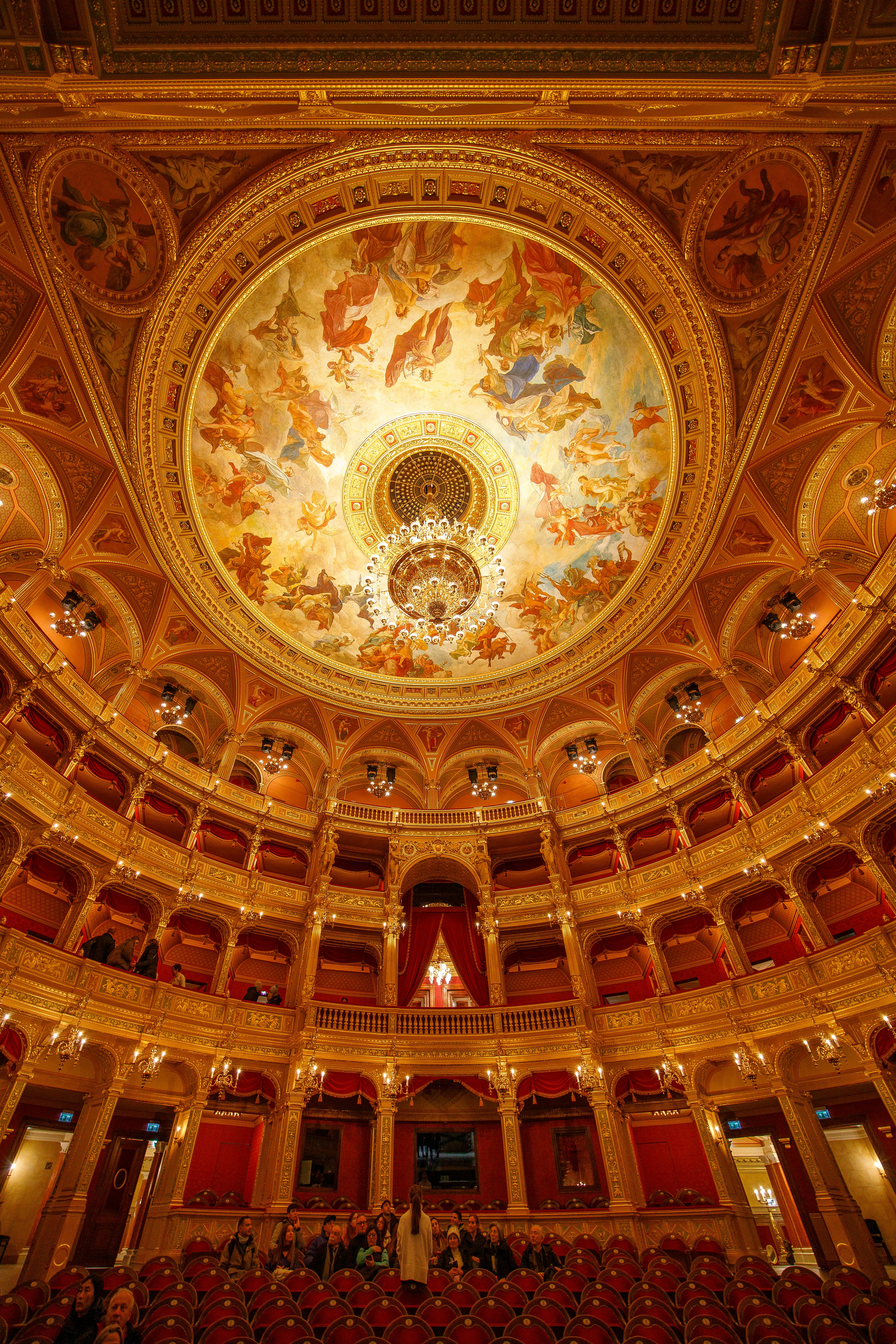Guests and tour guide inside the ornate Hungarian State Opera House.
