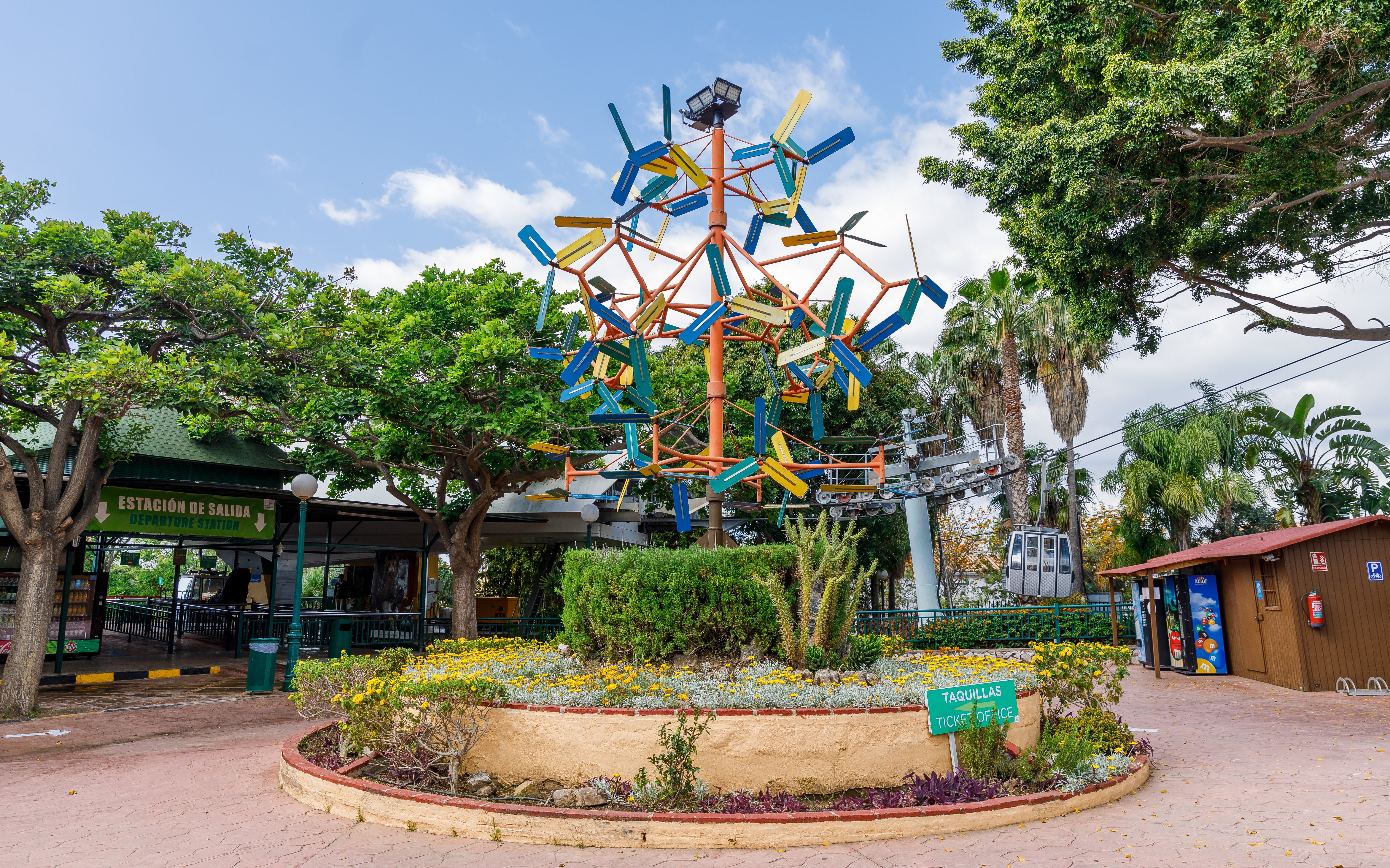 Benalmádena Cable Car entrance with colorful sculpture and ticket office.