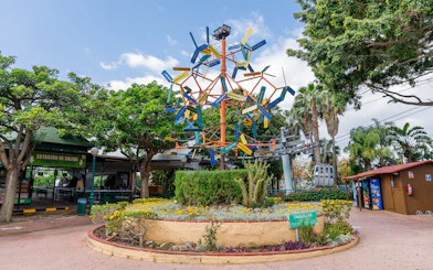 Benalmádena Cable Car entrance with colorful sculpture and ticket office.
