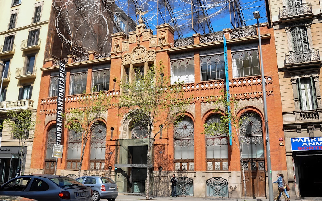 Fundació Antoni Tàpies building facade in Barcelona with modern art installation.