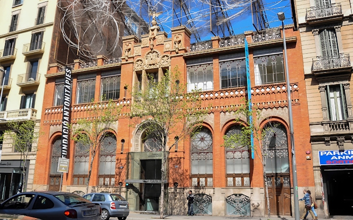 Fundació Antoni Tàpies building facade in Barcelona with modern art installation.