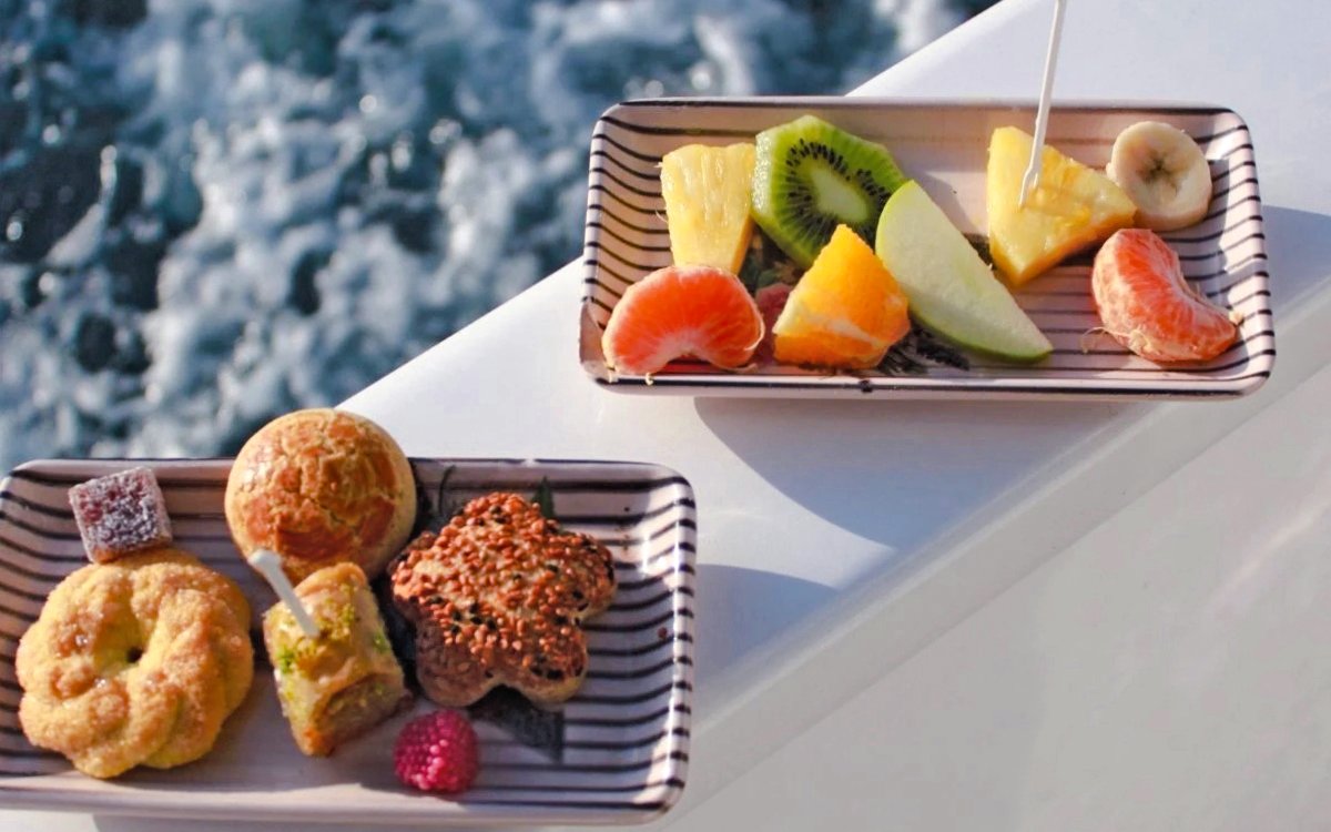 Fruit and pastry platters on a luxury yacht during a Bosphorus private cruise.