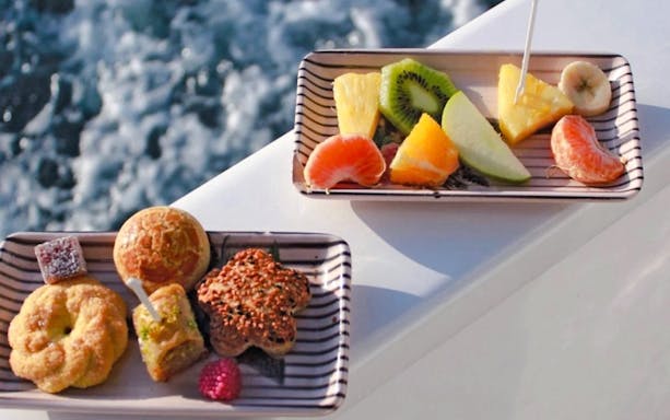 Fruit and pastry platters on a luxury yacht during a Bosphorus private cruise.