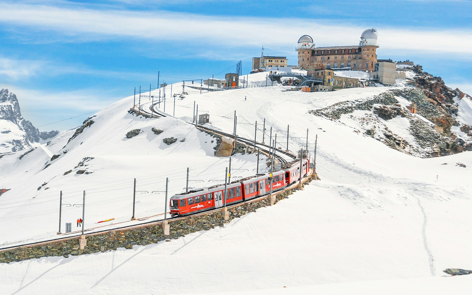 Gornergrat Bahn train leaving Kulmhotel Gornergrat with Matterhorn in background, Zermatt, Switzerland.