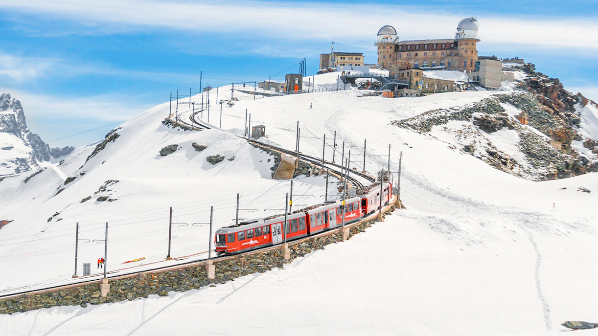 Gornergrat Bahn train leaving Kulmhotel Gornergrat with Matterhorn in background, Zermatt, Switzerland.