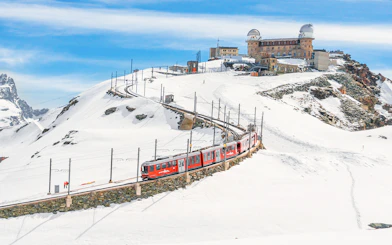 Gornergrat Bahn train leaving Kulmhotel Gornergrat with Matterhorn in background, Zermatt, Switzerland.