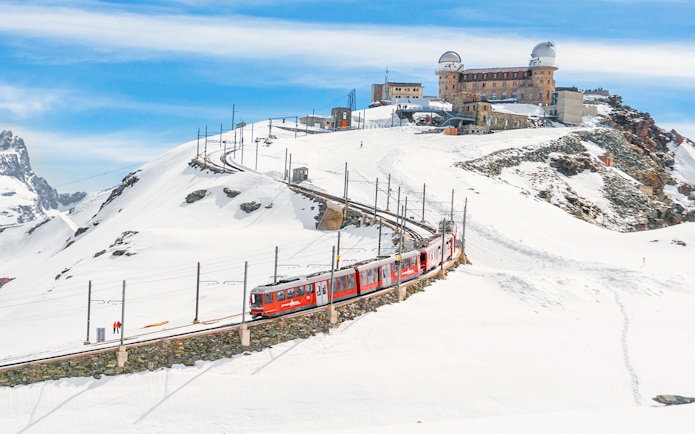 Gornergrat Bahn train leaving Kulmhotel Gornergrat with Matterhorn in background, Zermatt, Switzerland.