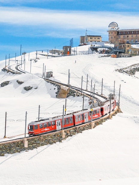Gornergrat Bahn train leaving Kulmhotel Gornergrat with Matterhorn in background, Zermatt, Switzerland.