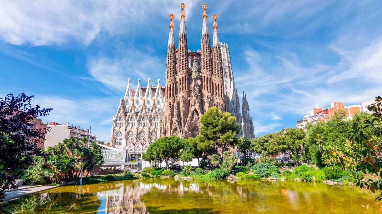 Sagrada Familia basilica with reflection in pond, Barcelona.