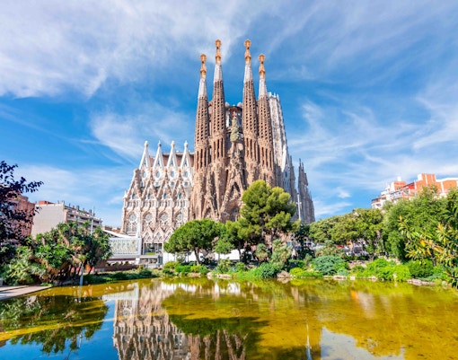 Sagrada Familia basilica with reflection in pond, Barcelona.