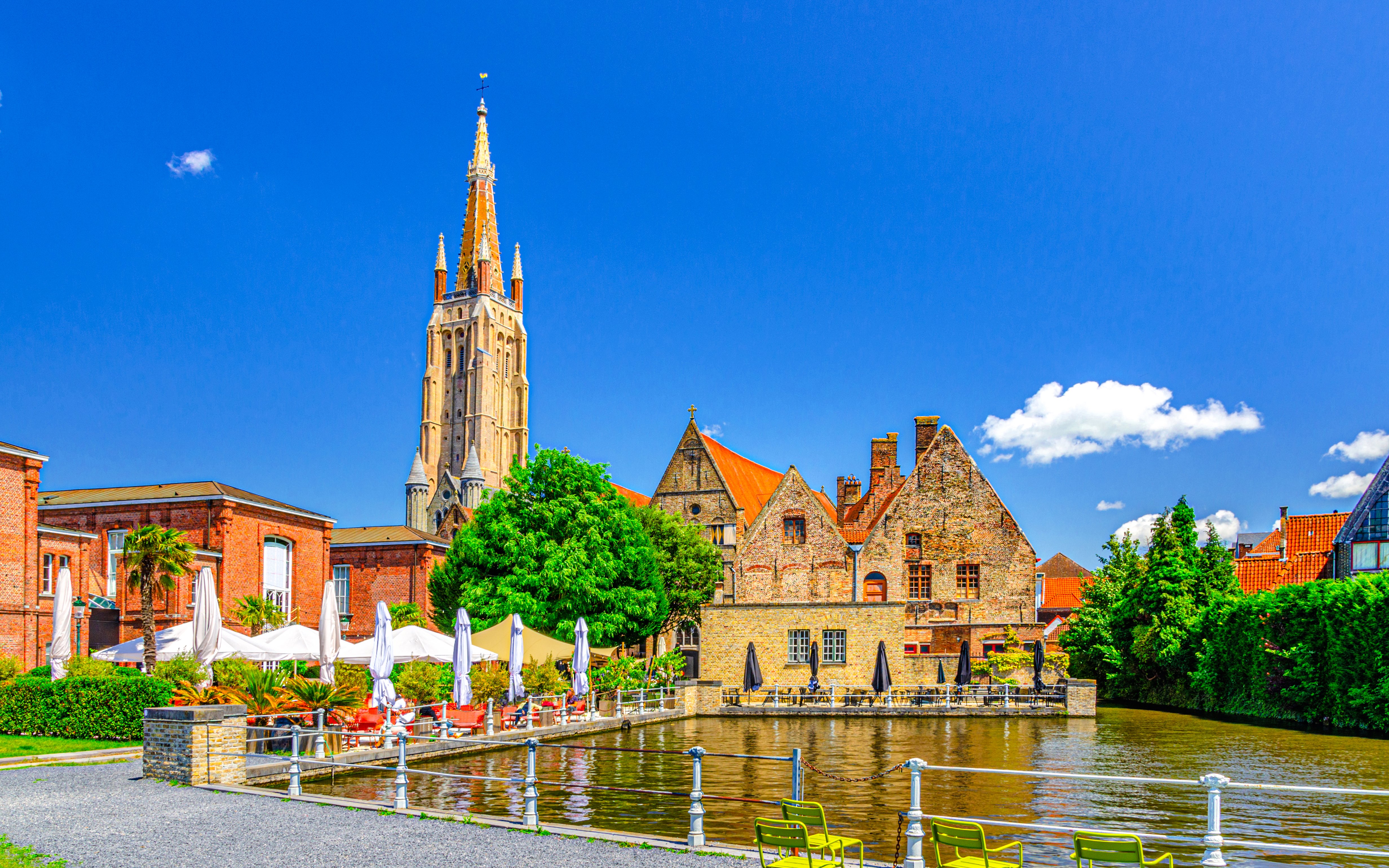 Bakkersrei canal with Church of Our Lady and Old St John’s Hospital in Brugge old town.