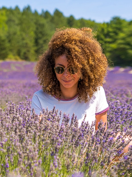Woman enjoying lavender field in Sault, France.