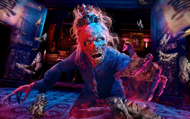Zombie character with glowing eyes and outstretched hand at Universal Studios Singapore R.I.P tour.