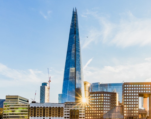 The Shard skyscraper in London with surrounding cityscape.