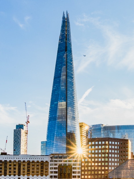 The Shard skyscraper in London with surrounding cityscape.