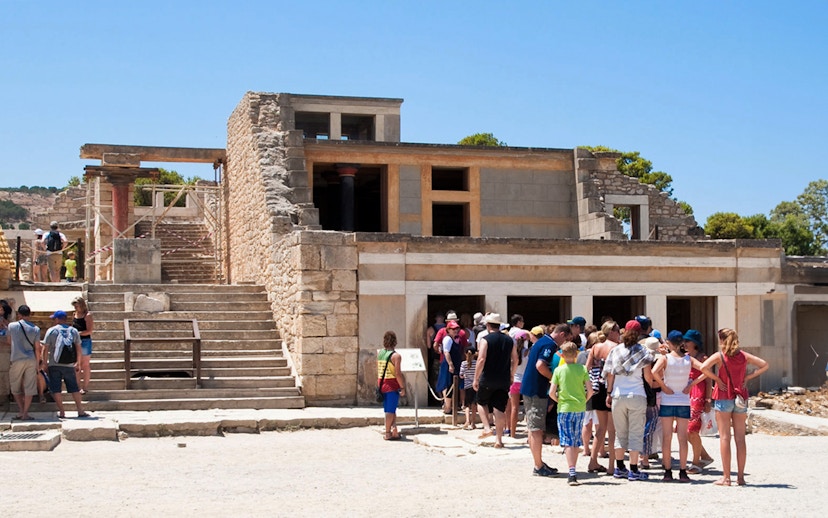 Visitors exploring the ruins of Knossos Palace in Crete.