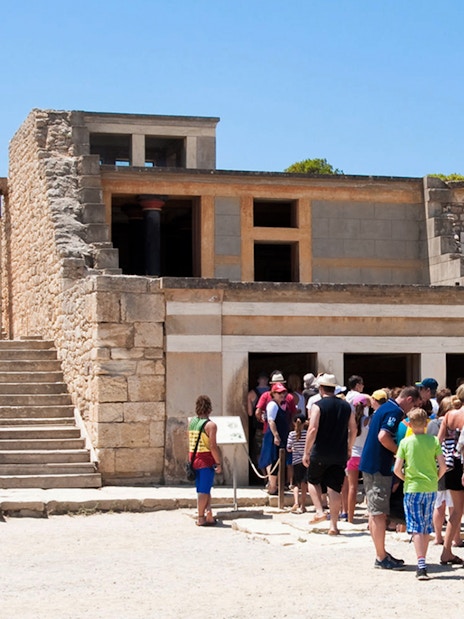 Visitors exploring the ruins of Knossos Palace in Crete.