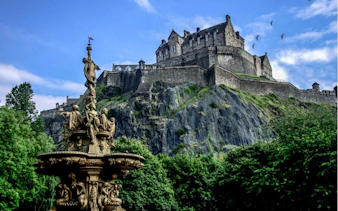 Edinburgh Castle atop Castle Rock with Ross Fountain in the foreground.