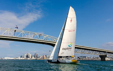 Sailing yacht on Auckland's Waitemata Harbour near the Harbour Bridge.
