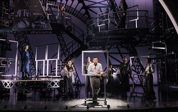Theatrical performance with actors on an industrial set, related to Lempicka.