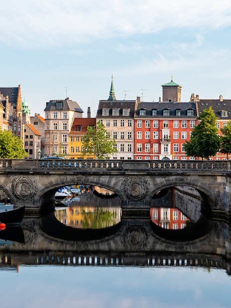 Marmorbroen bridge over canal with colorful buildings in Copenhagen, Denmark.