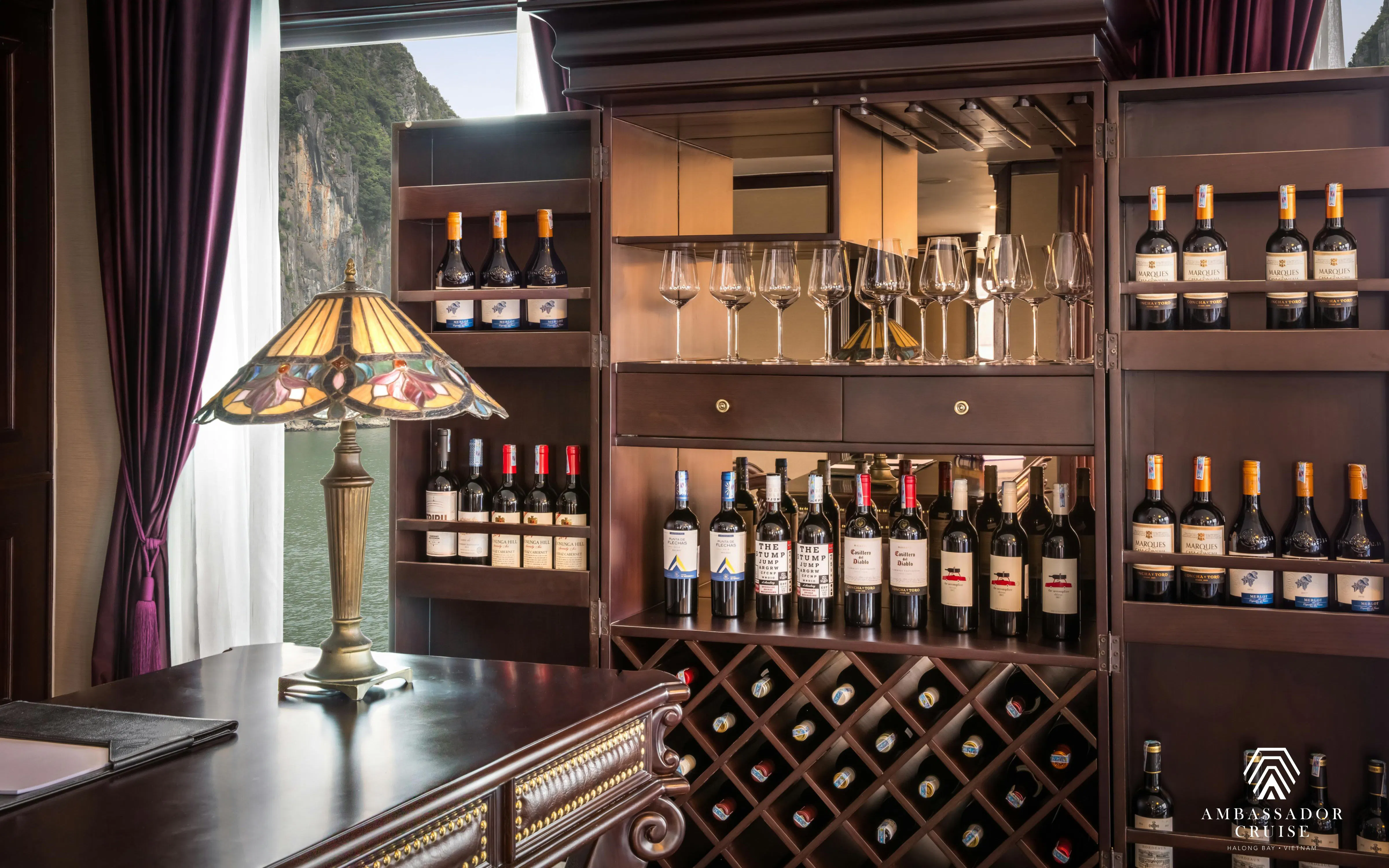 Wine selection and glasses in the bar area of a 5-star cruise on Ha Long Bay.
