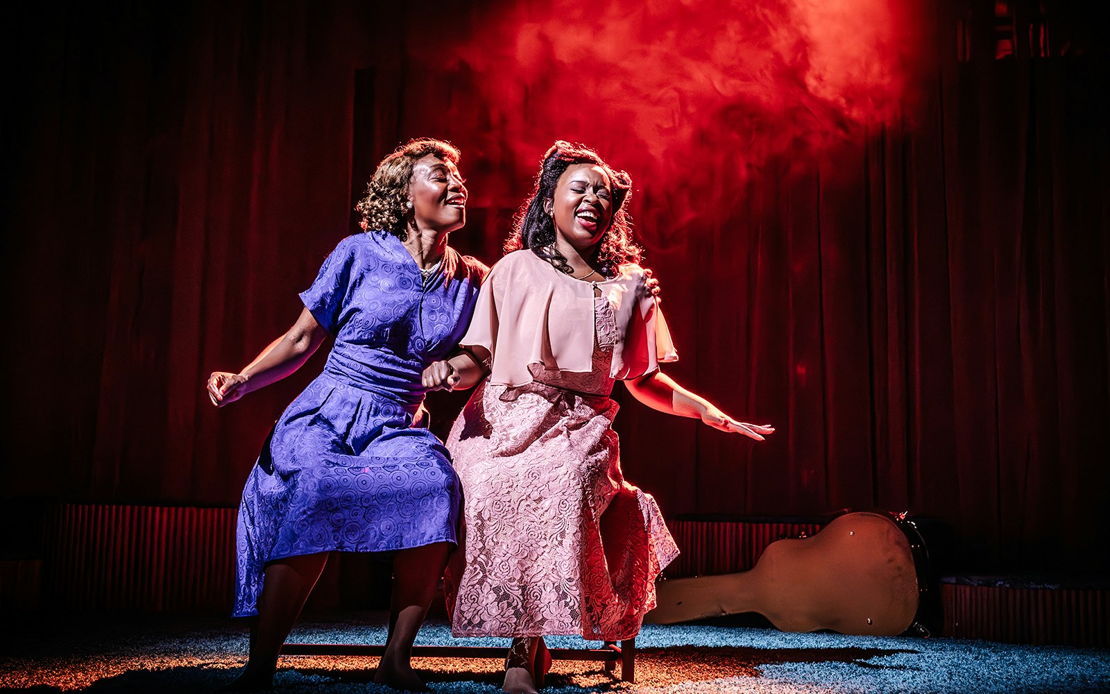 Two performers sing passionately on stage in a scene from Marie & Rosetta production.