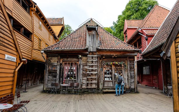 Narrow alley with historic wooden trading houses in Bryggen, Bergen.