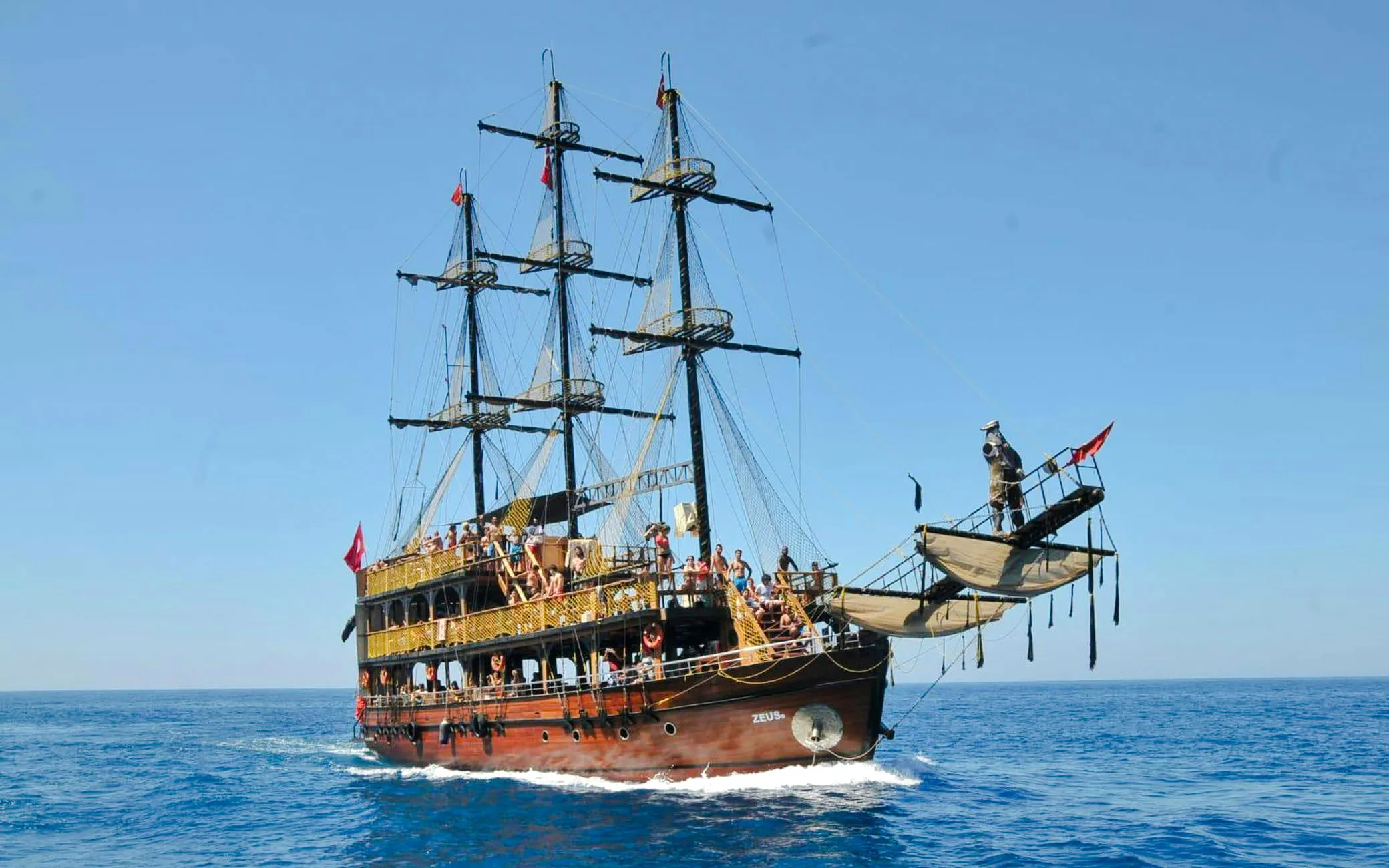 Pirate-themed boat with tourists sailing in Alanya, Turkey.