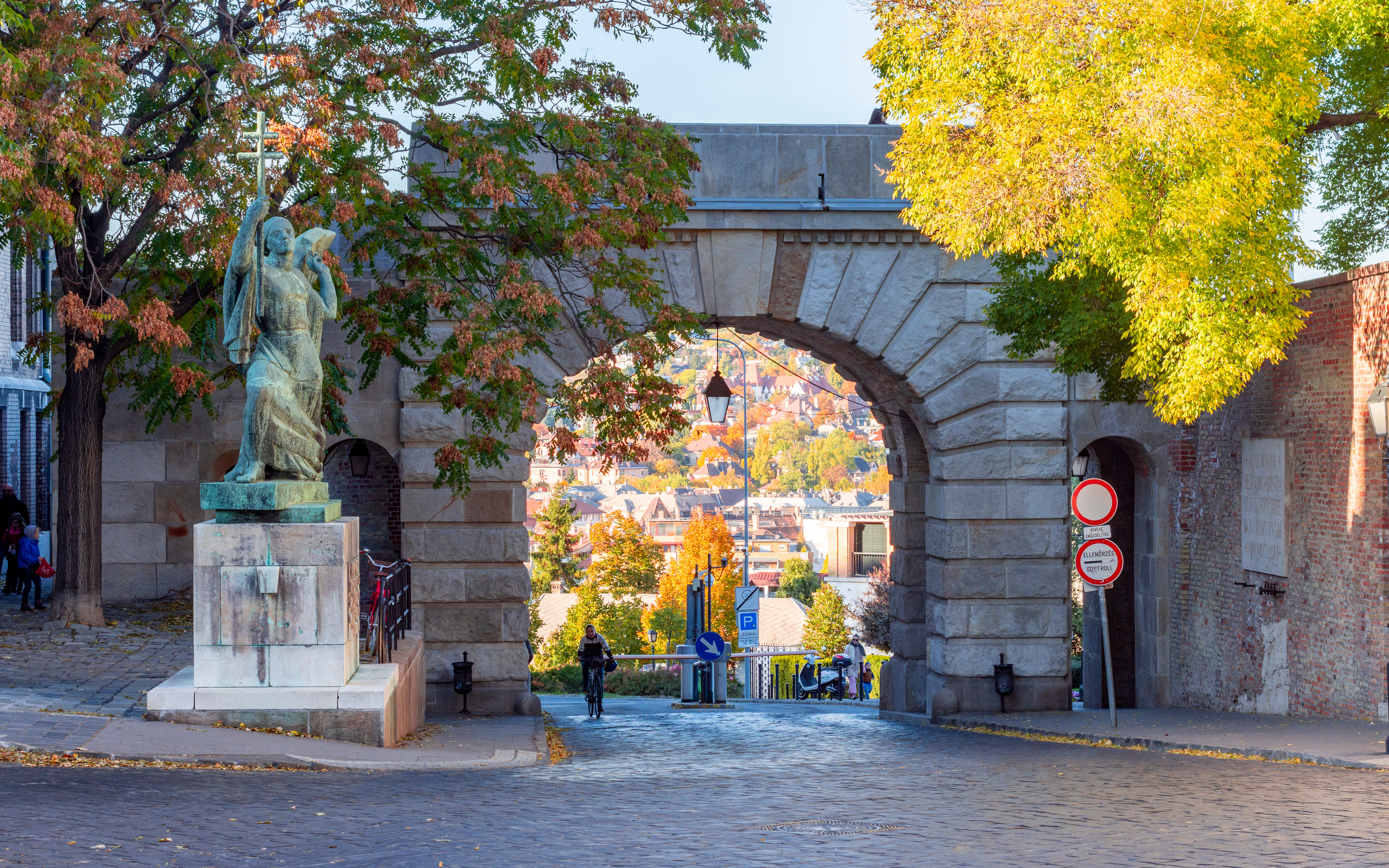 Vienna Gate on Buda Hill with statue and autumn trees, Budapest, Hungary.