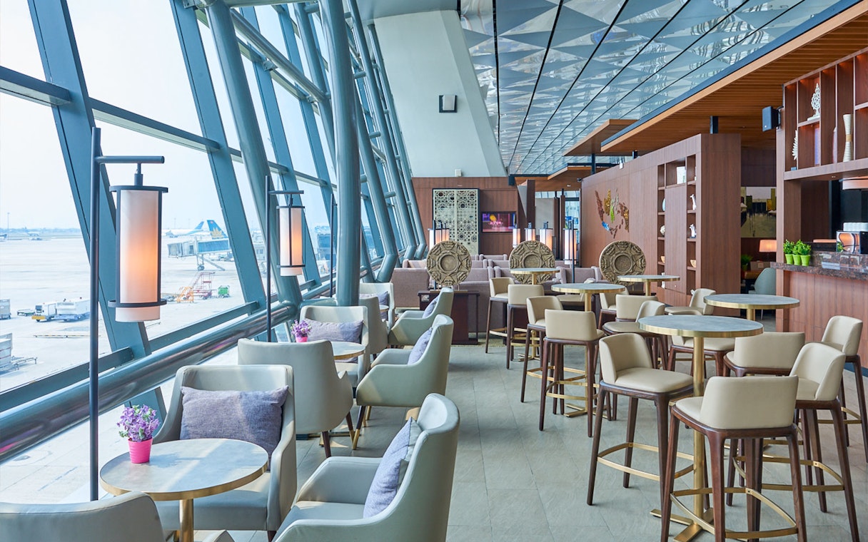 Sapphire Lounge seating area, T3 International Departures, near Gate 7, with airport view.