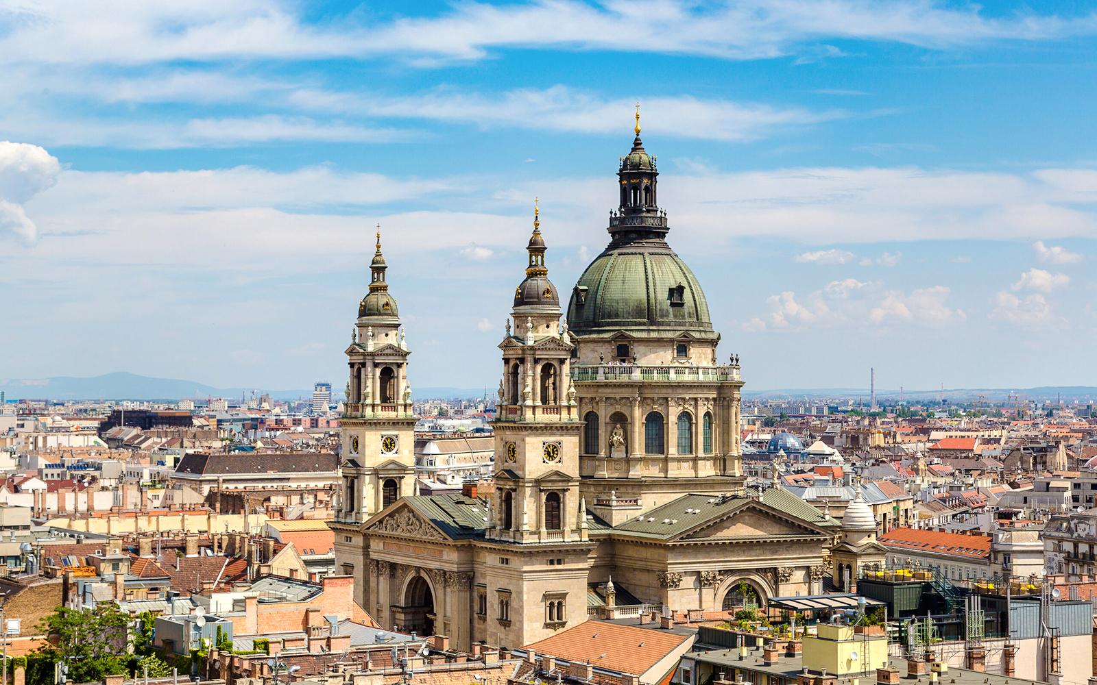 St. Stephen's Basilica with Budapest skyline during walking tour.