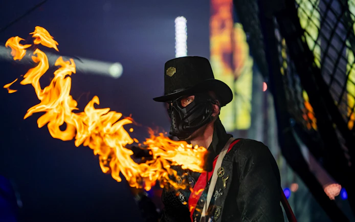 Performer with fire at Phuket Aqua Circus show.